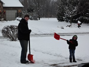 Dustin and Aidan shoveling snow