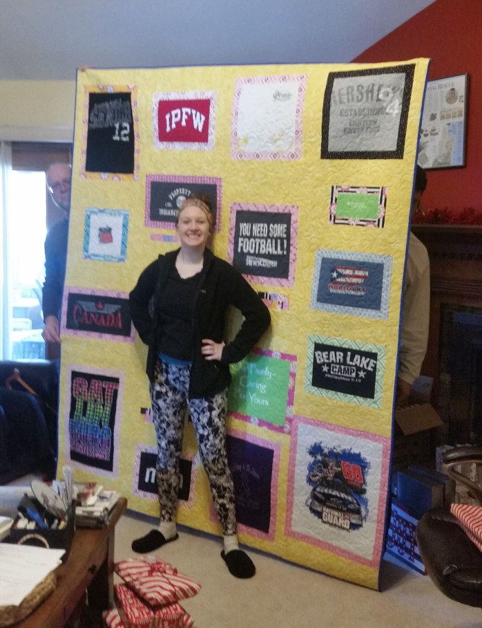 Ashley in front of her quilt